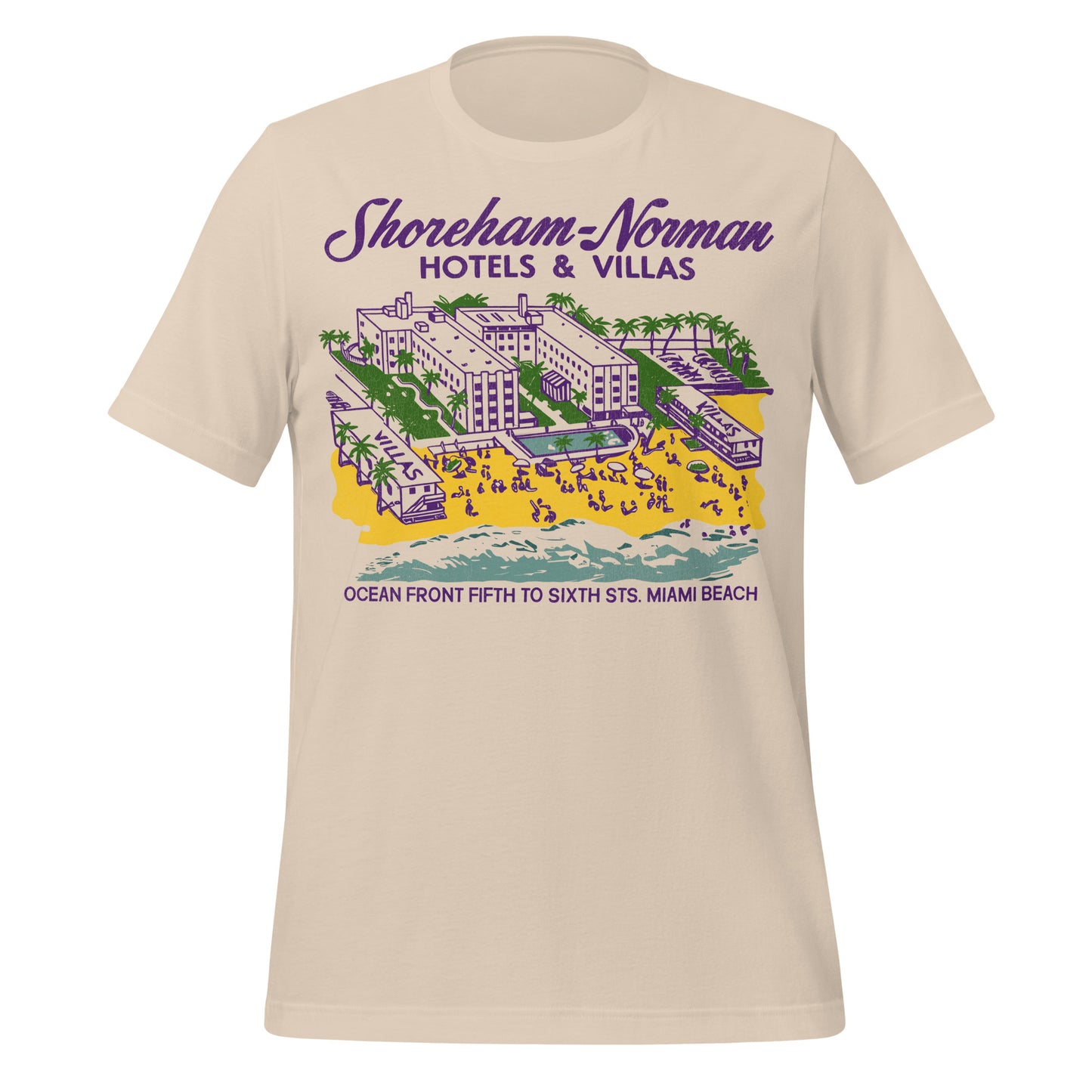 A vintage soft cream colored short sleeve t-shirt with a Florida hotel on the private beach next to the sea, palm trees, tourists, and two villas that says Shoreham-Norman Hotels & Villas Ocean Front Fifth to Sixth Sts. Miami Beach.