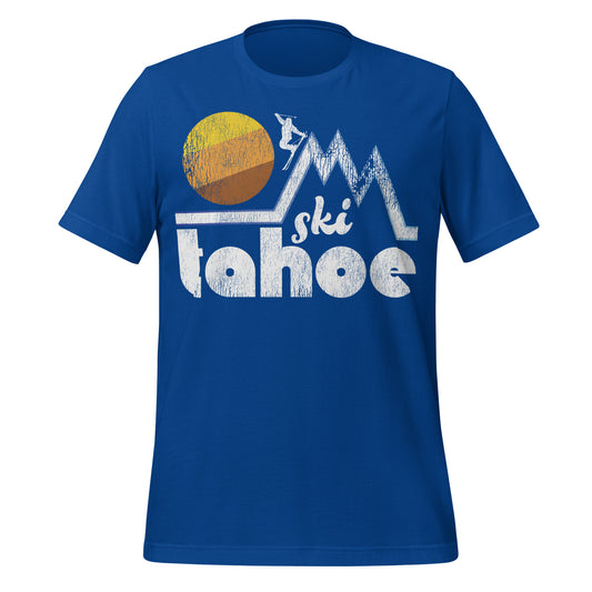 A vintage 70s style royal blue "Ski Tahoe" t-shirt with a the picture of a skier on a mountain range and a large circular tricolored sun. References Lake Tahoe, nestled between the Sierra Nevadas and Carson Mountain Range, known for its many popular ski resorts.