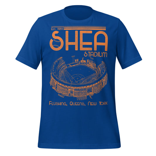 A royal blue retro Shea Stadium short sleeve t-shirt that says "Est. 1964" and "Flushing, Queens, New York" with an image of the baseball stadium. References the William A Shea Municipal Stadium which was home to both the MLB team New York Mets and the NFL team the New York Jets.