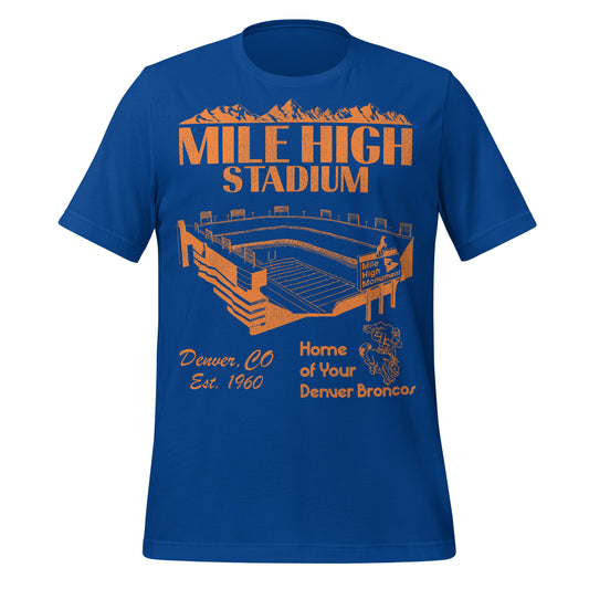 A retro royal blue t-shirt that says "Mile High Stadium" under the image of an orange mountainscape and "Denver, CO" and "Est. 1960". Says "Home of Your Denver Broncos", the NFL team. Has an image of the stadium which was the home of the football team from 1960-2000 with a sign saying "Mile High Monument" and the football team's logo, a man football player riding on Thunder, an Arabian horse.