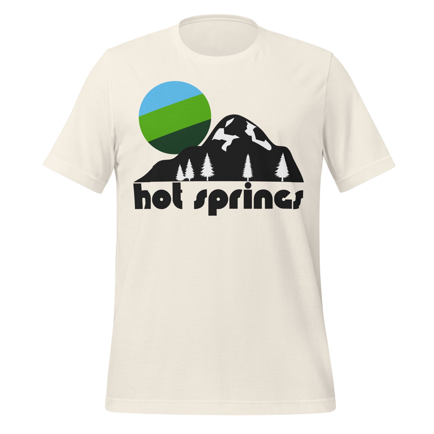 A retro, 80s style "Hot Springs" vintage white colored t-shirt. Includes the image of a hilly landscape with some crags and snow, pine trees dotting the ground, and a blue, forest green, and bright green sun. References Hot Springs National Park in Garland County, Arkansas, with ancient thermal springs, beautiful mountains, camping and backpacking opportunities, and the historic Bathhouse Row.