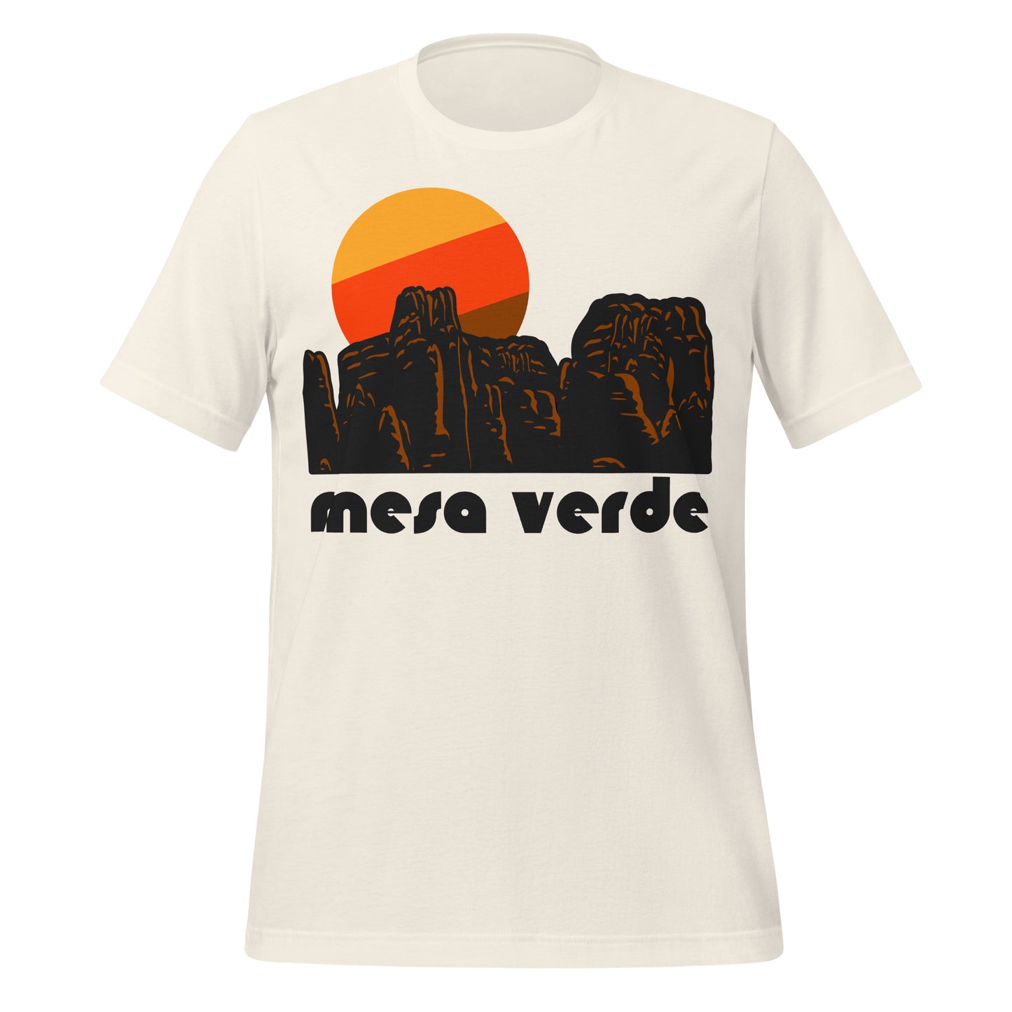 A retro, souvenir vintage white colored t-shirt with the words 'mesa verde' under the image of a rocky landscape with reddish color, assembling granite, and an orange, red, and brown sun setting. References Montezuma County's Mesa Verde National Park, known around the world for its well preserved cliff dwellings from the Ancestral Puebloan culture, like Cliff Palace.