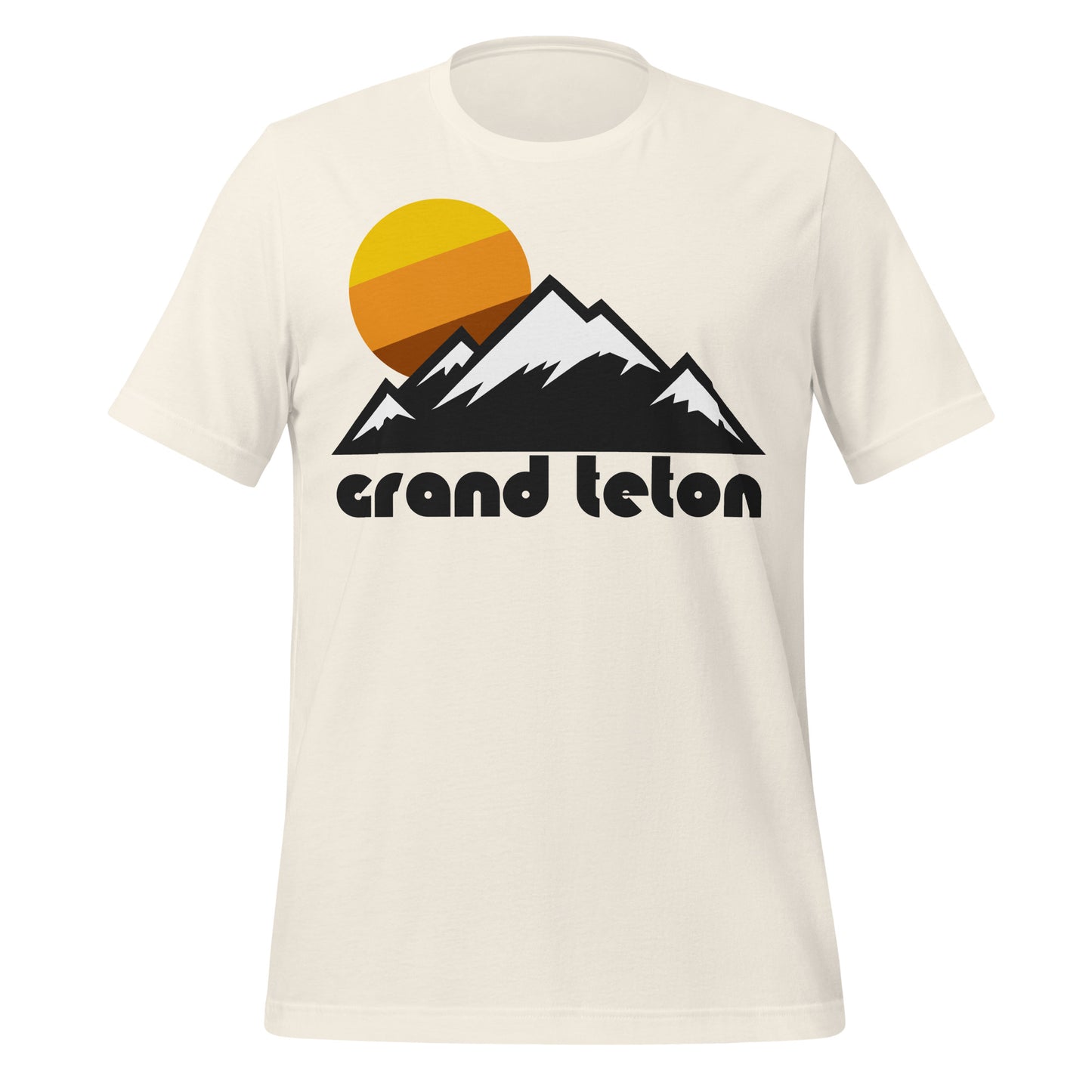 A vintage white colored 70s style t-shirt with the image of a tricolored sun on top of multiple mountains, their peaks covered in snow, representing Wyoming's Grand Teton Mountain Range in Grand Teton National Park near Yellowstone National Park.