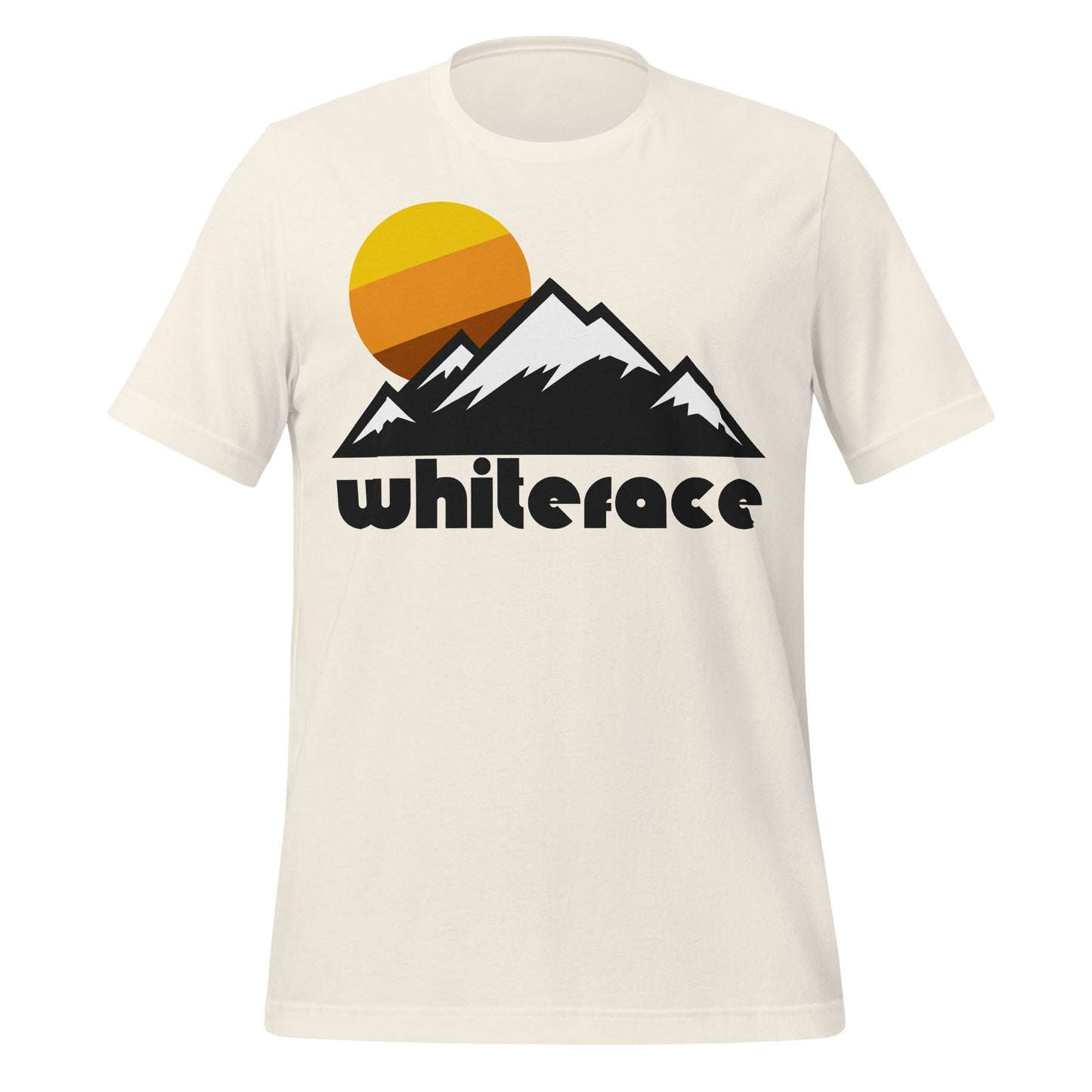 A vintage white colored retro 70s stye t-shirt that says "Whiteface" - in reference to Whiteface Mountain Ski Resort in New York, and the Whiteface Range in the Adirondacks. Image of mountains covered in snow under a setting yellow/orange/brown circular sun.