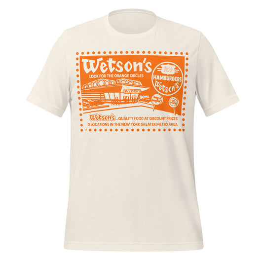 A white retro t-shirt with orange text "Wetson's Look for the Orange Circles" with an orange burger joint picture saying "Wetson's" and street sign that says "15¢ Hamburgers Wetson's" and "US Finest", and "buy a bagful". Also text reading "Wetson's... Quality Food at Discount Prices 70 locations in the New York Greater Metro Area." Shirt references the burger company from the 60s and 70s.