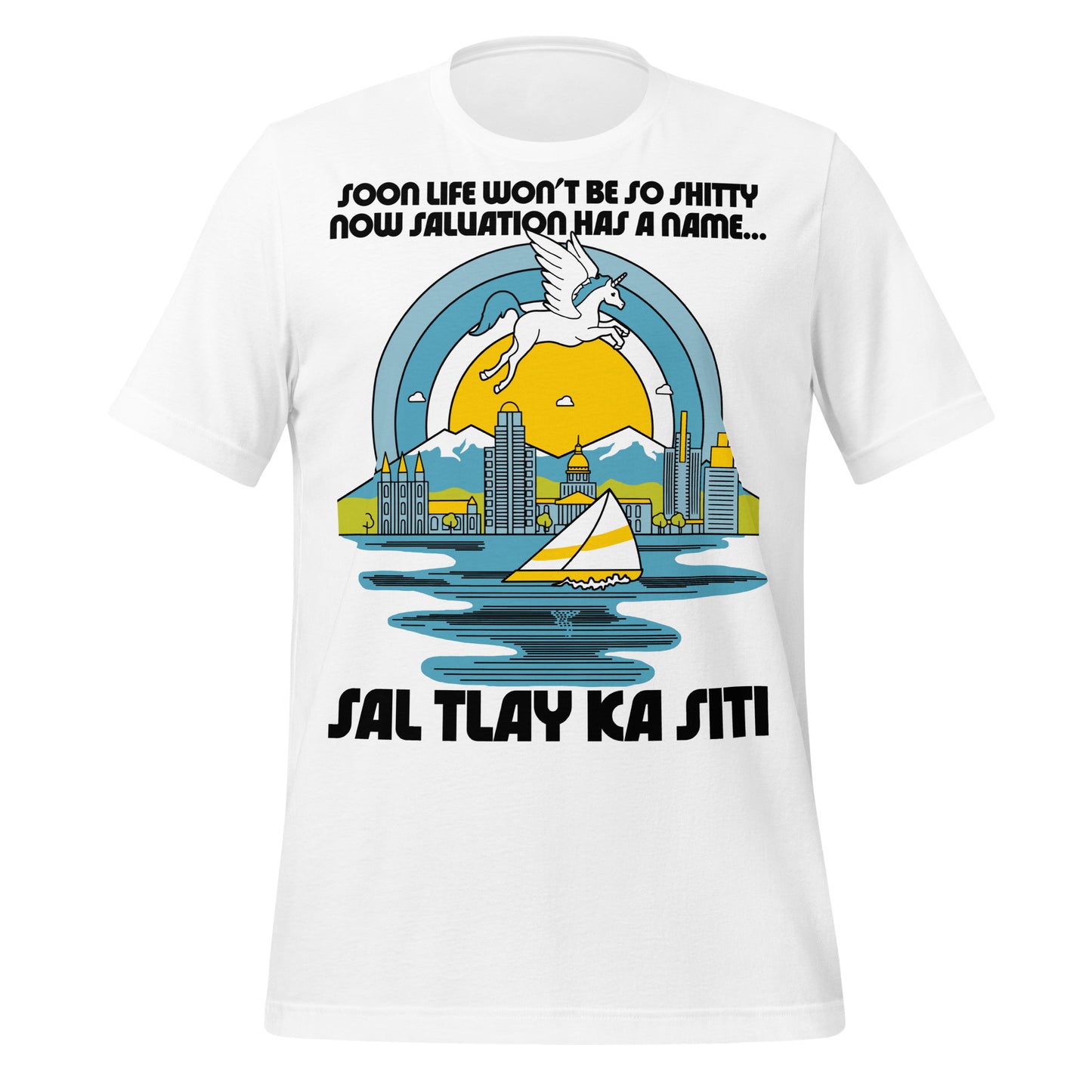 A white colored vintage t-shirt that says "Sal Tlay Ka Siti" and "Soon Life Won't Be So Shitty Now Salvation Has A Name...", which is a reference to lyrics from Nabulungi's song from the Book of Mormon musical. Image of a magic unicorn flying over blue snow covered mountains behind the Salt Lake City skyline, the Great Salt Lake with a sailboat, and a sun surrounded by blue rings, as Nabulung fantasizes about paradise.