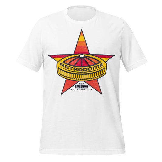 A short sleeved white vintage t-shirt for tourists that says Astrodome, the first domed stadium which was established in 1965 in Houston, TX. Image of a five pointed pink, orange, yellow, and red star, referencing the Lone Star of Texas, under a graphic of the stadium with a domed top. Home of the Houston Astros and Houston Oilers.