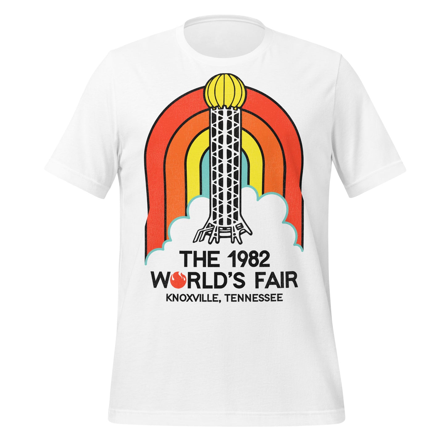 A white 80s style retro t-shirt that says "The 1982 World's Fair" from "Knoxville, Tennessee" with a fire logo for the "O". Has an image of a red, orange, yellow, and blue rainbow and the Sunsphere steel tower which was a restaurant and observation deck. The fair's theme was "Energy Turns the World".