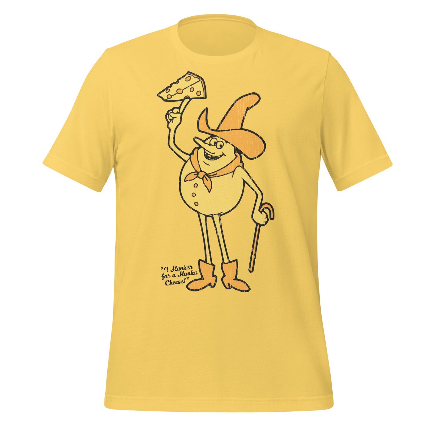 A yellow retro short sleeve t-shirt that says "I Hanker for a Hunka Cheese!" with an image of a cheese cowboy man with a hat, a scarf, a cane, and boots holding a piece of cheese with holes. Refers to Timer from the series 'Time for Timer'.