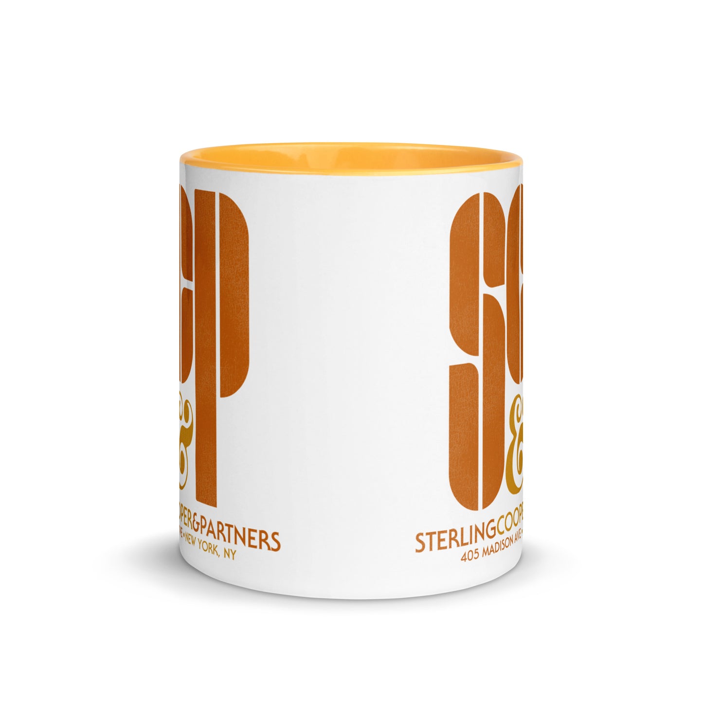 A souvenir white ceramic mug with an orange color inside that has the "SCP" logo and says "Sterling Cooper & Partners" and the address" 405 Madison Ave + New York, NY". References the TV show Mad Men from New York City.