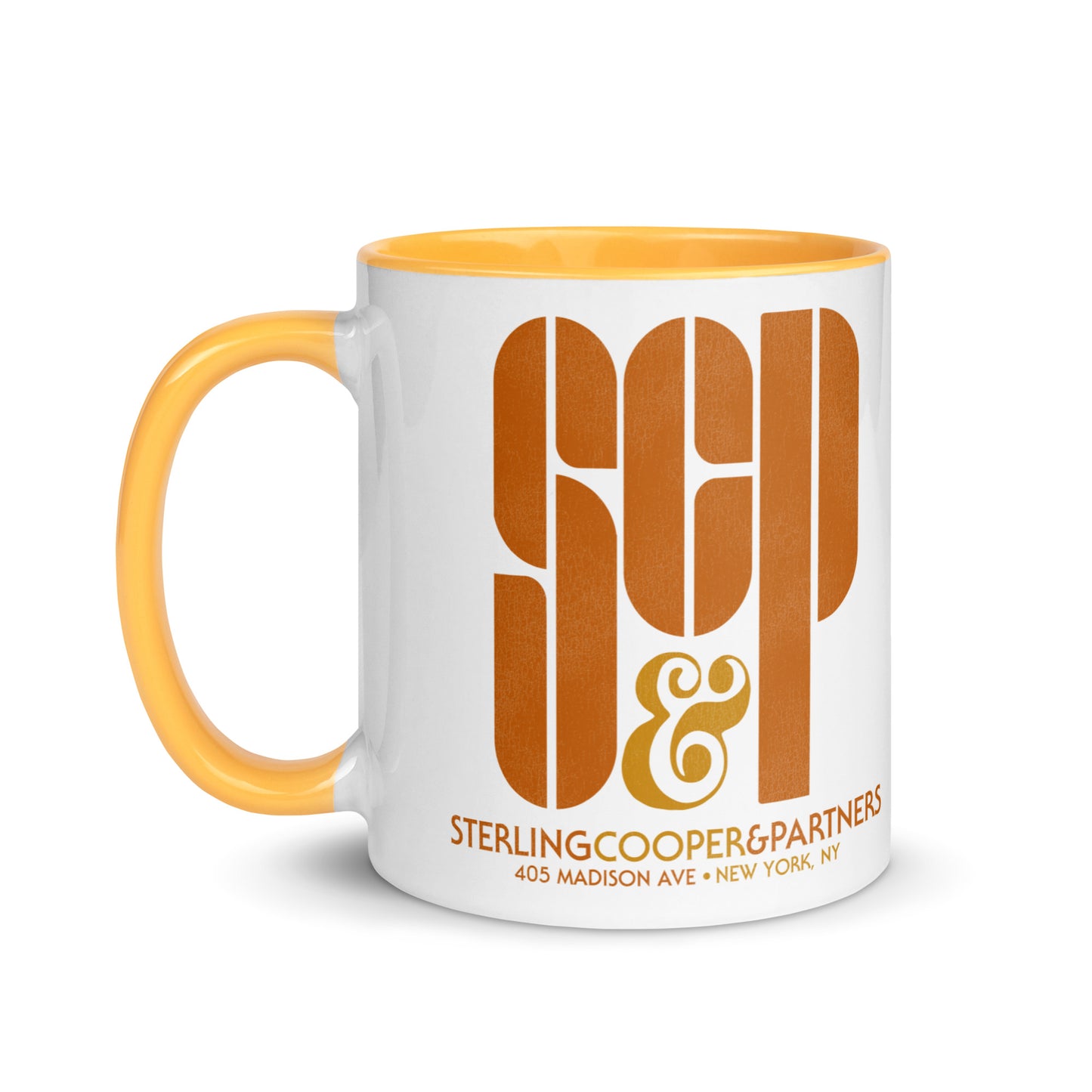 A 60s style white and yellow ceramic mug with color inside that says "SCP & Sterling Cooper & Parters 405 Madison Ave + New York, NY". Refers to the advertisement industry television show Mad Men in the 1960s.