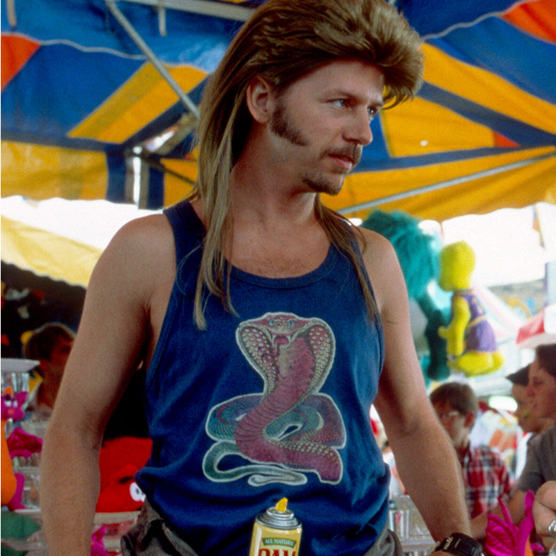 a man with long hair wearing a blue tank top