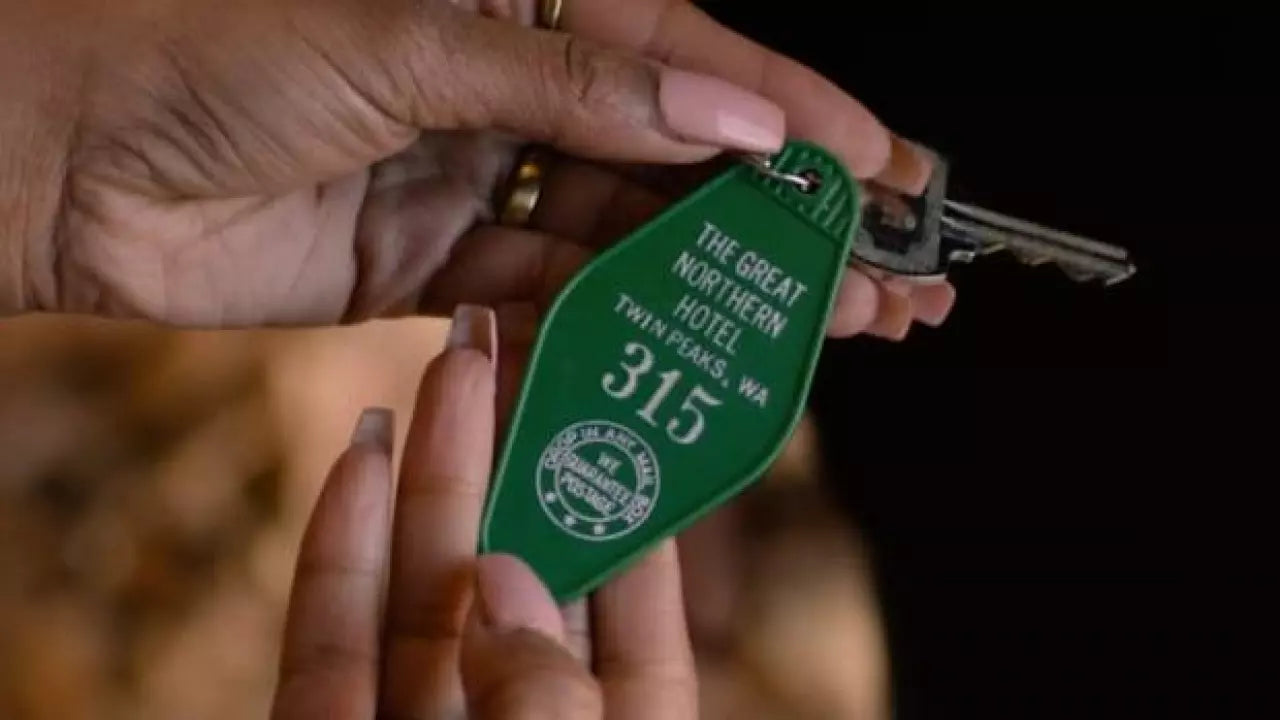 a person holding a key to another person's house