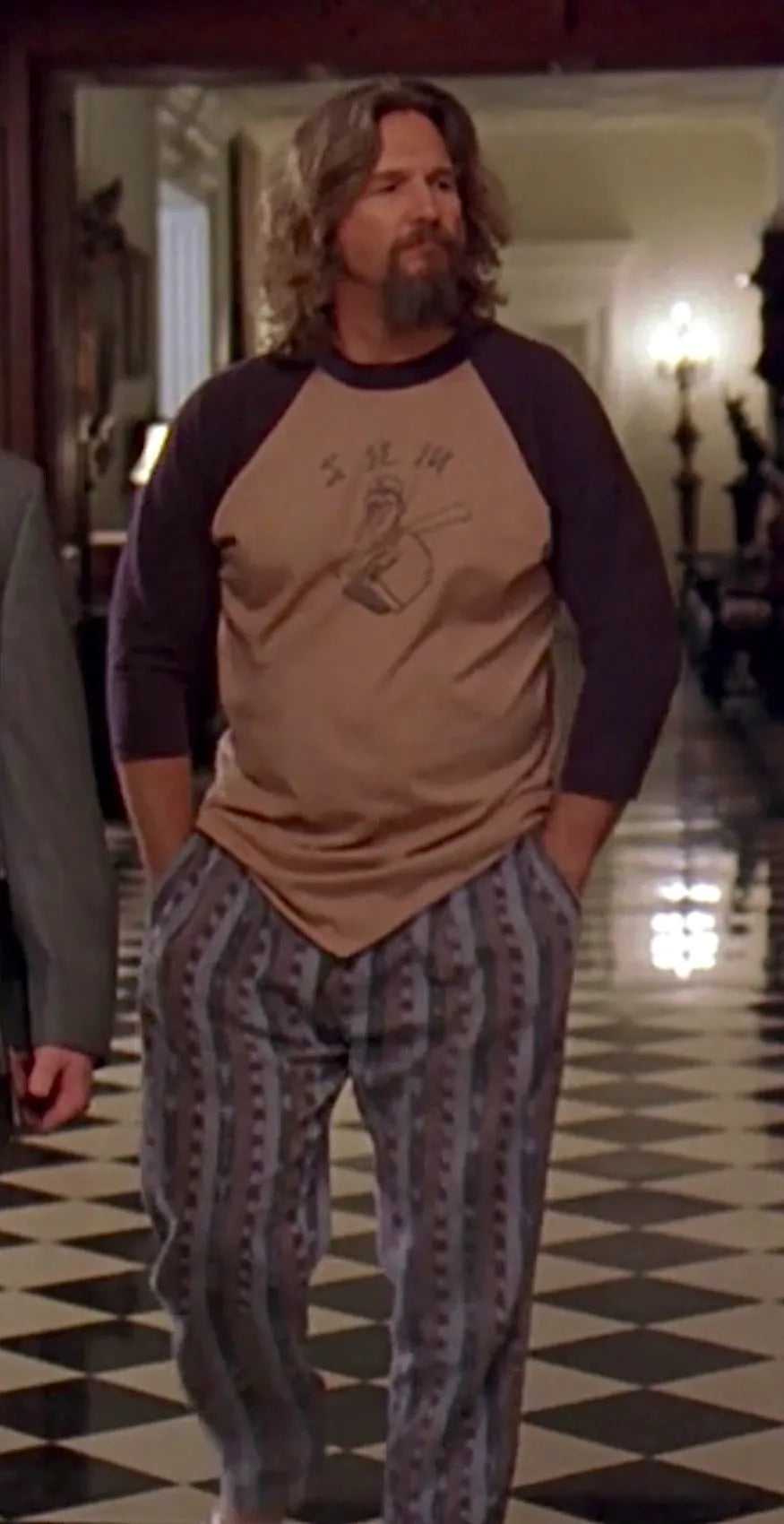 a man with long hair and a beard wearing pajamas