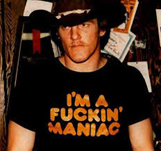 a man wearing a black shirt and a hat
