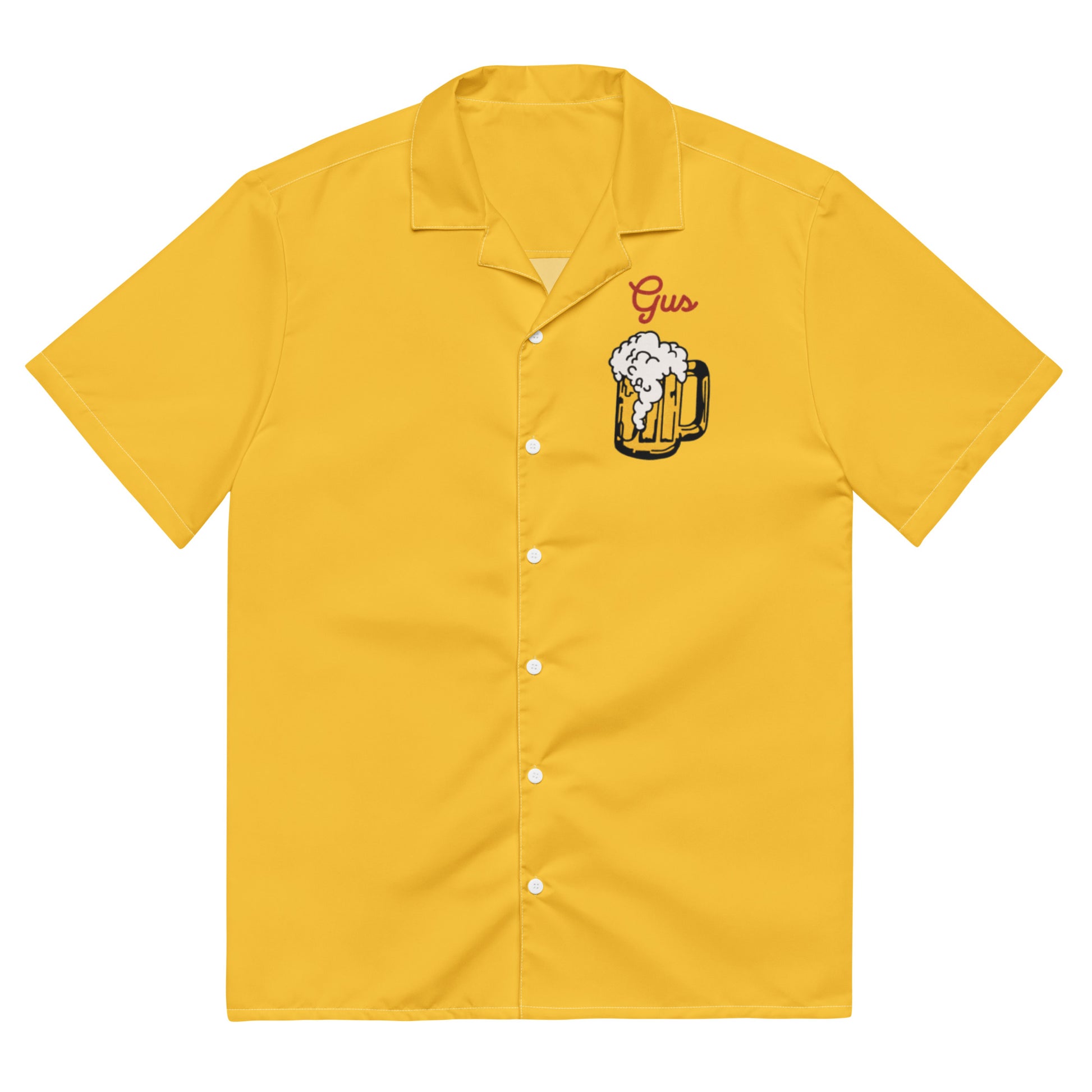 The front of a vintage mustard yellow button up costume shirt that says "Gus". Image of beer foaming out of a tankard. Worn by actor John Candy and character Gus Polinski in the movie "Home Alone". 