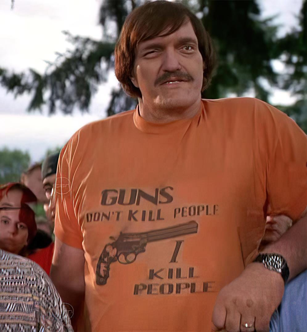 Mr. Larson played by Richard Kiel in the movie Happy Gilmore. He is wearing an orange shirt saying 'Guns Don't Kill People, I Kill People.'