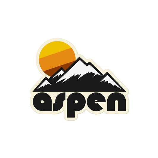 A retro "aspen" kiss cut sticker that includes the image of a mountain range with snow and a setting warm colored sun, referencing the town in Rocky Mountain National Park. 