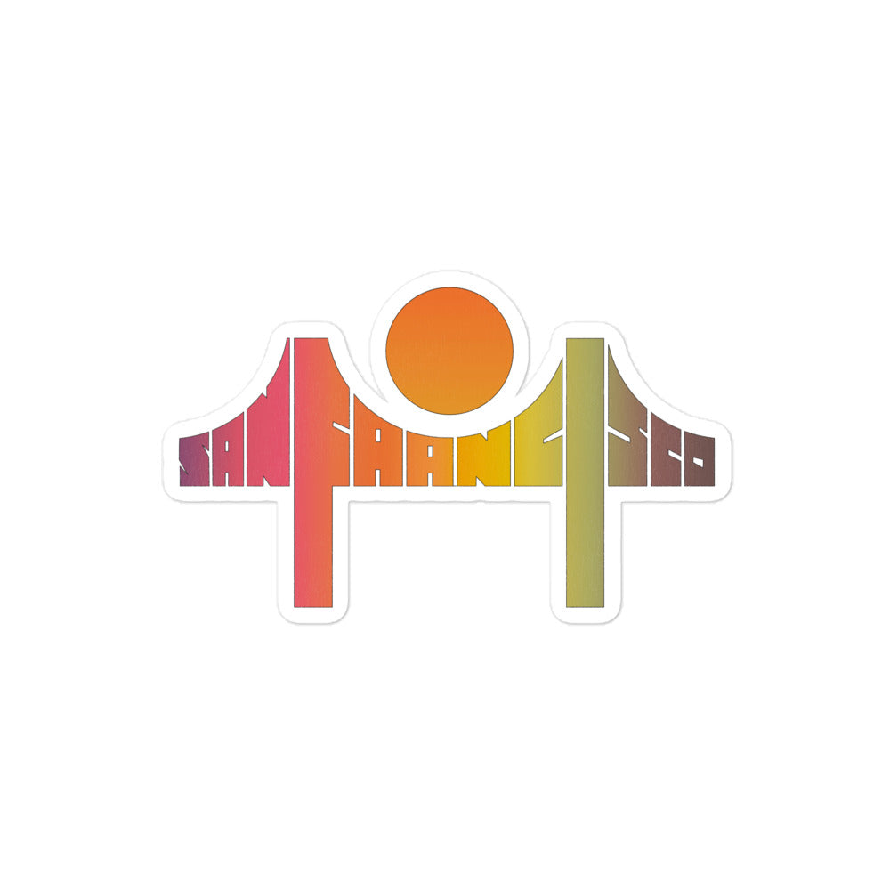A retro kiss cut sticker that says San Francisco in hombre purple, pink, orange, yellow, and green with an orange sun in the shape of the Golden Gate bridge. 