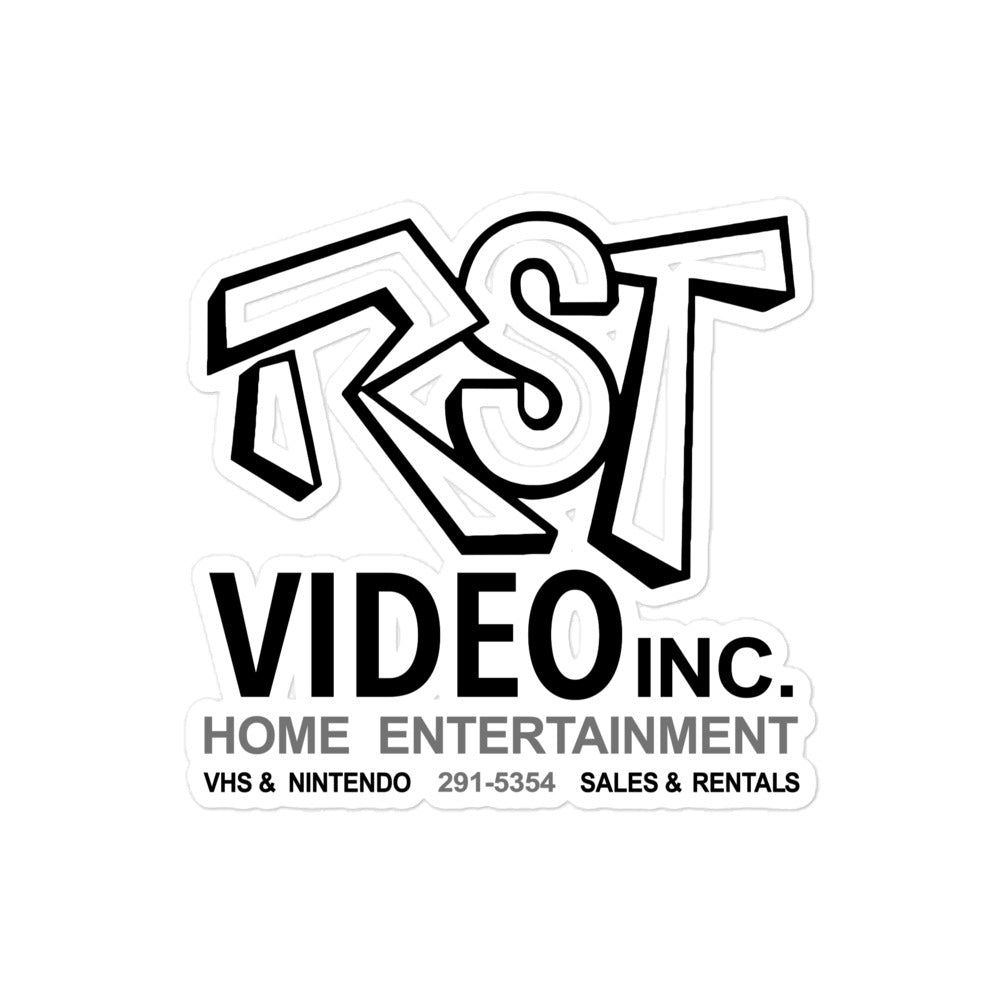 A vintage kiss-cut sticker that says "RST Video Inc. Home Entertainment", "VHS & NIntendo", the number "291-5354", and "Sales & Rentals". 