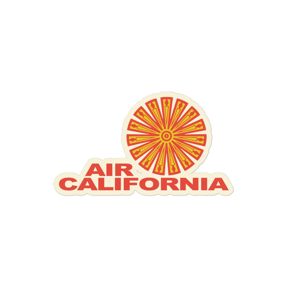 A retro kiss cut sticker that says "Air California" with a yellow and red spiral logo. 