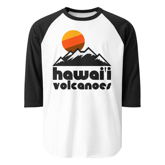 A 3/4 sleeve raglan style white and black souvenir t-shirt that says "Hawai'i Volcanoes" under an image of mountains and a setting orange/yellow/brown sun. References Hawai'i Volcanoes National Park, located on the Big Island, known for Kīlauea Volcano and Mauna Loa Volcano as well as the Crater Rim Drive, as well as being a UNESCO World Heritage Site. 