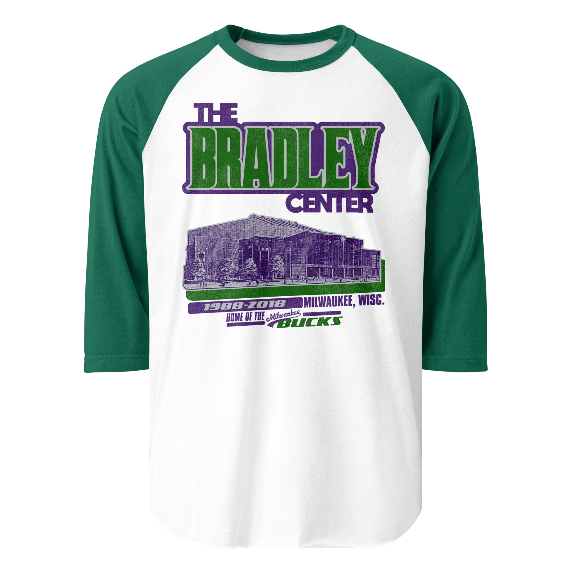 A 3/4 sleeve raglan style green and white retro shirt for The Bradley Center in Milwaukee, Wisc., Home of the Milwaukee Bucks from 1988-2018. Image of the stadium from the street in purple with a green shadow, representing the Bucks colors. 