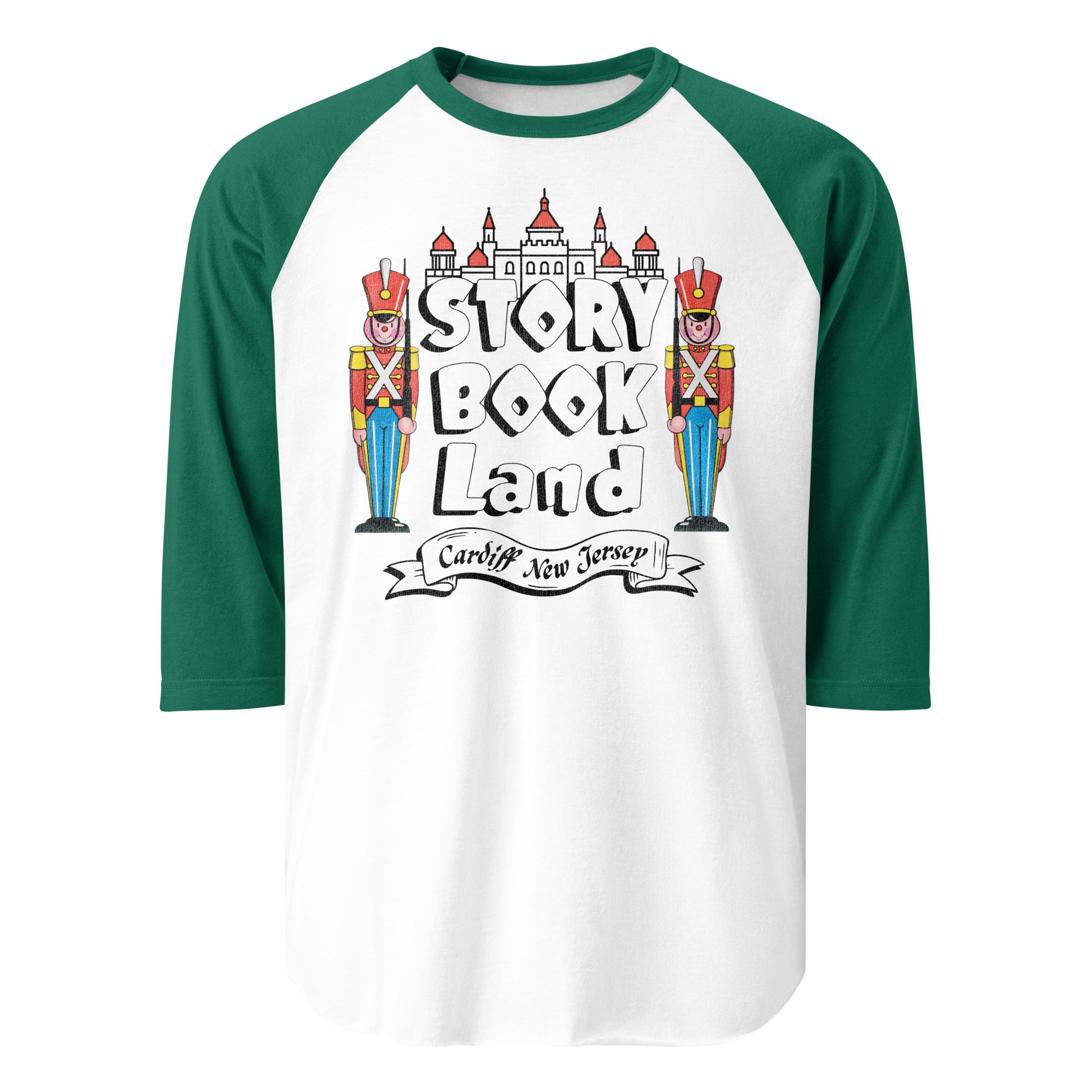 A retro forest green and white three quarter sleeve shirt that says Story Book Land in bubble letters and "Cardiff New Jersey". Has two toy soldiers resembling the Nutcracker or London palace guards and a palace. 