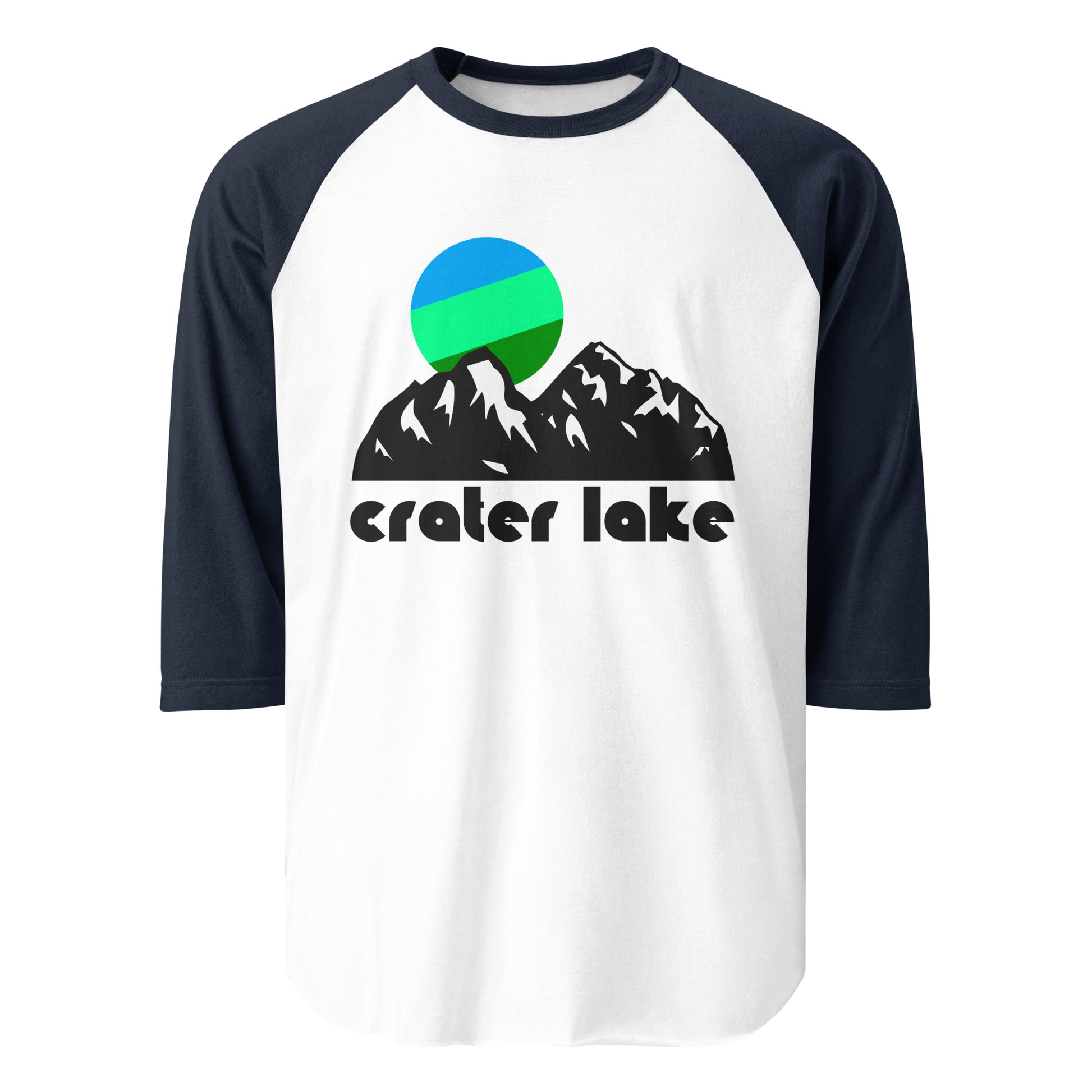 A navy and white colored 3/4 sleeve retro raglan style shirt. Says Crater Lake and includes a graphic of a mountainside and a cool toned green/blue sun hanging above the peaks, referencing Crater Lake National Park in Oregon, within the Cascade Mountain Range, formed when Mount Mazama's collapse, with incredible opportunities for adventurers from hikers to backpackers to bikers to bird watching. 