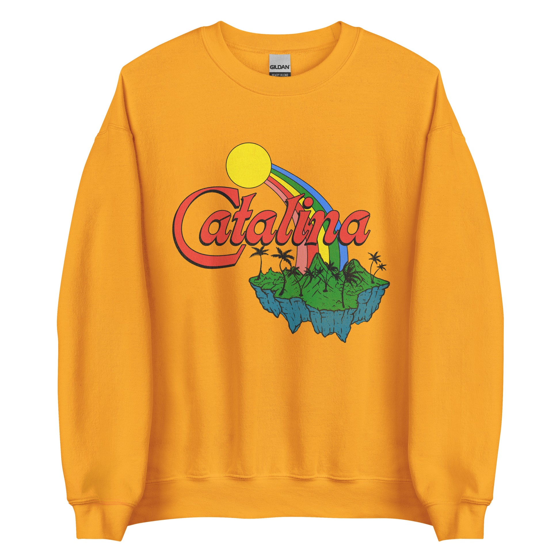 A gold colored retro crew neck sweatshirt that says "Catalina". Image of sunshine, rainbow, and green island with palm trees and mountains. 