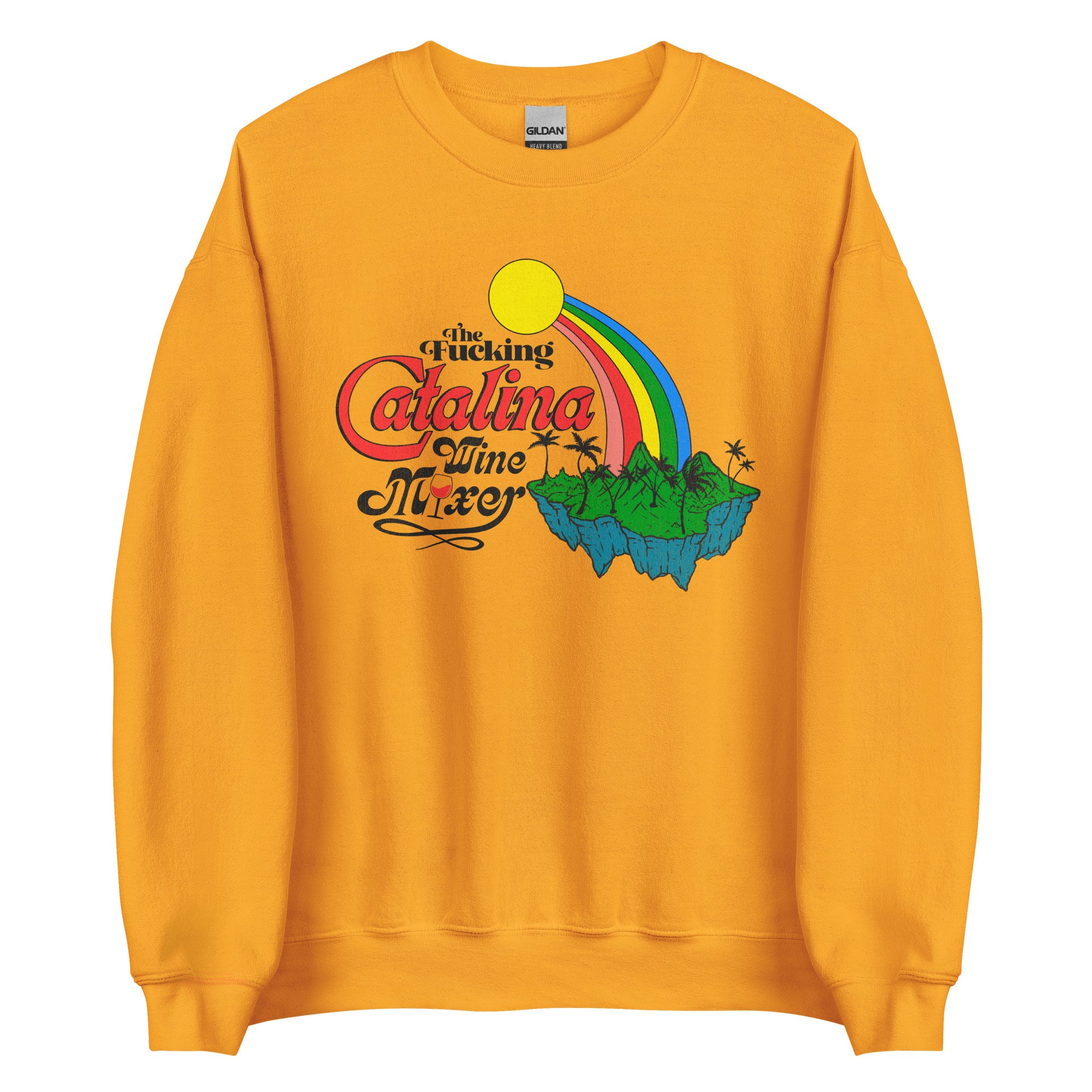 A vintage gold travel crew neck sweatshirt that says "The Fucking Catalina Wine Mixer", referencing Santa Catalina Island east of the Los Angeles coast. Image of a forest green island with palm trees and mountains connected to a yellow sun by a pink, red, yellow, green, and blue rainbow. 