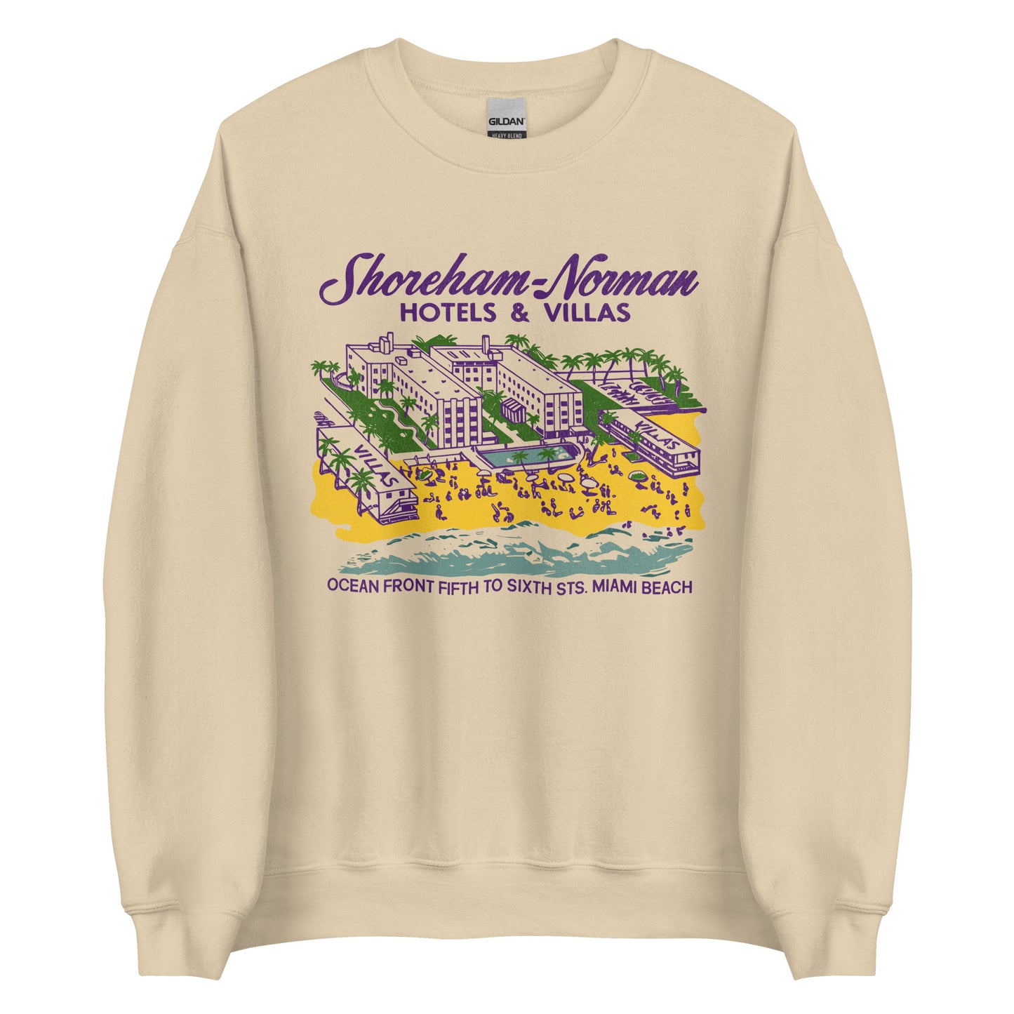 A travel retro style sand colored crew neck sweatshirt that says Shoreham-Norman Hotels & Villas Ocean Front Fifth to Sixth Sts. Miami Beach. Has a Florida hotel with villas, beach, ocean, tourists, a pool, and palm trees referring to the Twin Hotels & Motels in Florida. 