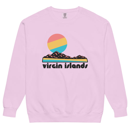 An orchid light pink colored Virgin Islands National Park souvenir crew neck sweatshirt that says "Virgin Islands" under the image of a rocky landscape, a beach, and a pink, yellow, and blue sun. The national park includes beaches like Trunk Bay and Cinnamon Bay, coral reefs, plantation ruins, and Bourdeaux Mountain on Saint John Island. 