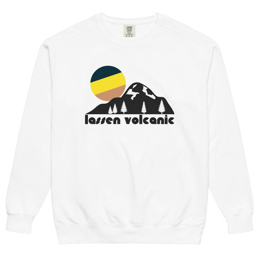 A 70s style tourist Lassen Volcanic National Park white colored crew neck sweatshirt with a beautiful mountain, forest, and setting sun artistic image. Says 'Lassen Volcanic', referencing the Californian National Park with trails connecting to the popular Pacific Crest Trail and with incredible volcanoes such as the Lassen Volcano, famous for its status as the largest plug dome volcano in the world. 