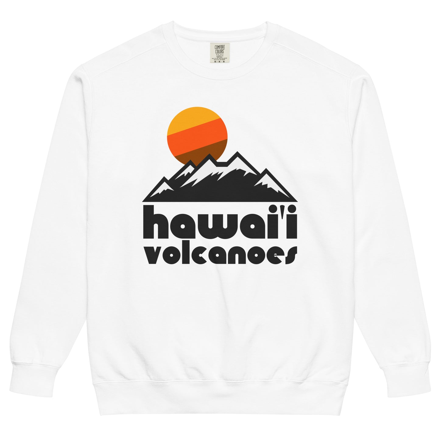 A white colored crew neck sweatshirt for travel that says "Hawai'i Volcanoes", referencing Hawai'i Volcanoes National Park, under a mountain landscape with a picturesque sun in yellow/orange/brown colors. Known for its two active volcanoes, Mauna Loa and Kīlauea, as well as the Crater Rim Drive, the Chain of Craters Road, the Thurston Lava Tube, and Halema'uma'u Crater. 