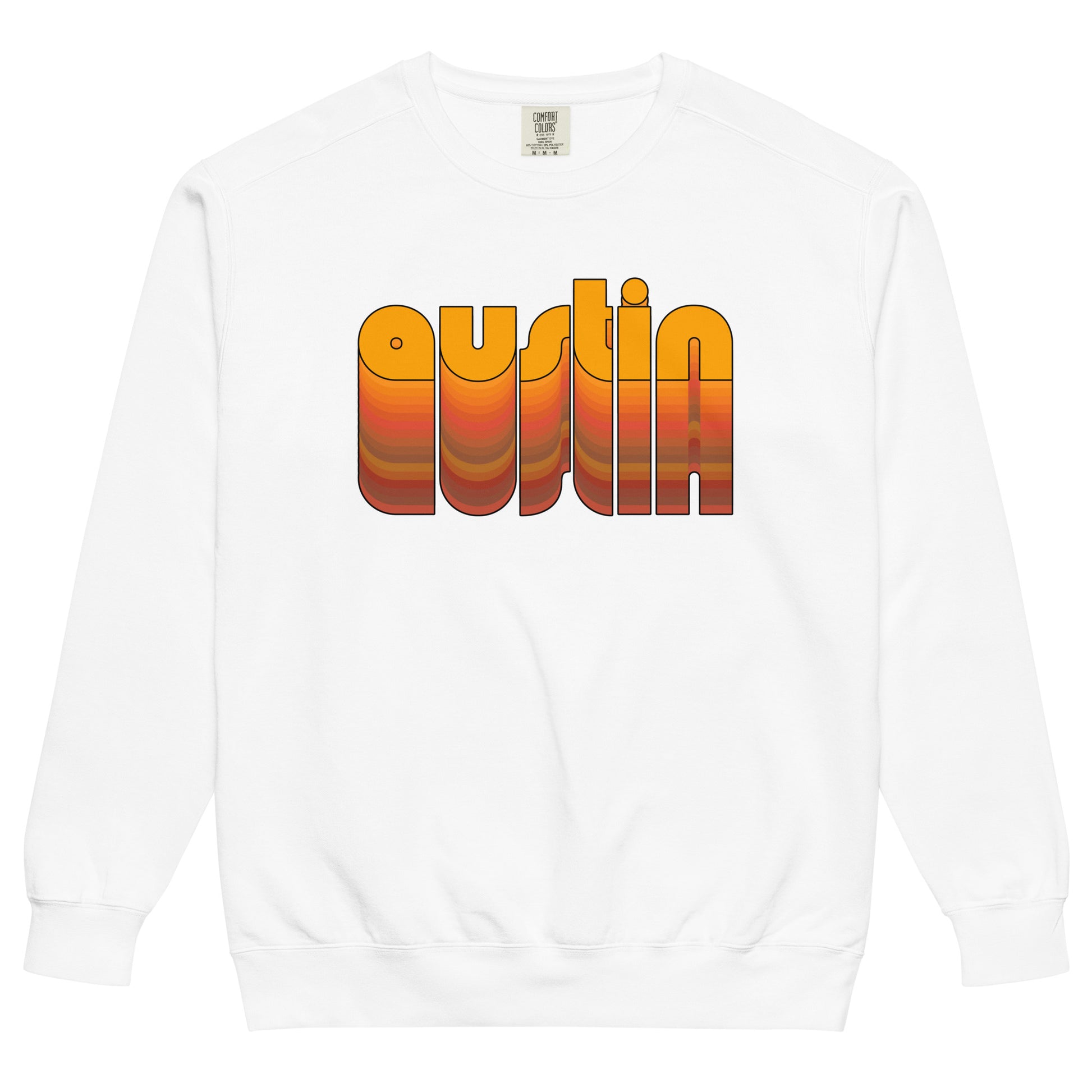 A white crew neck 70s style Austin, Texas sweatshirt for travel. Includes the word "Austin" in lowercase, orange, bubble letters that fade into many other colors. 