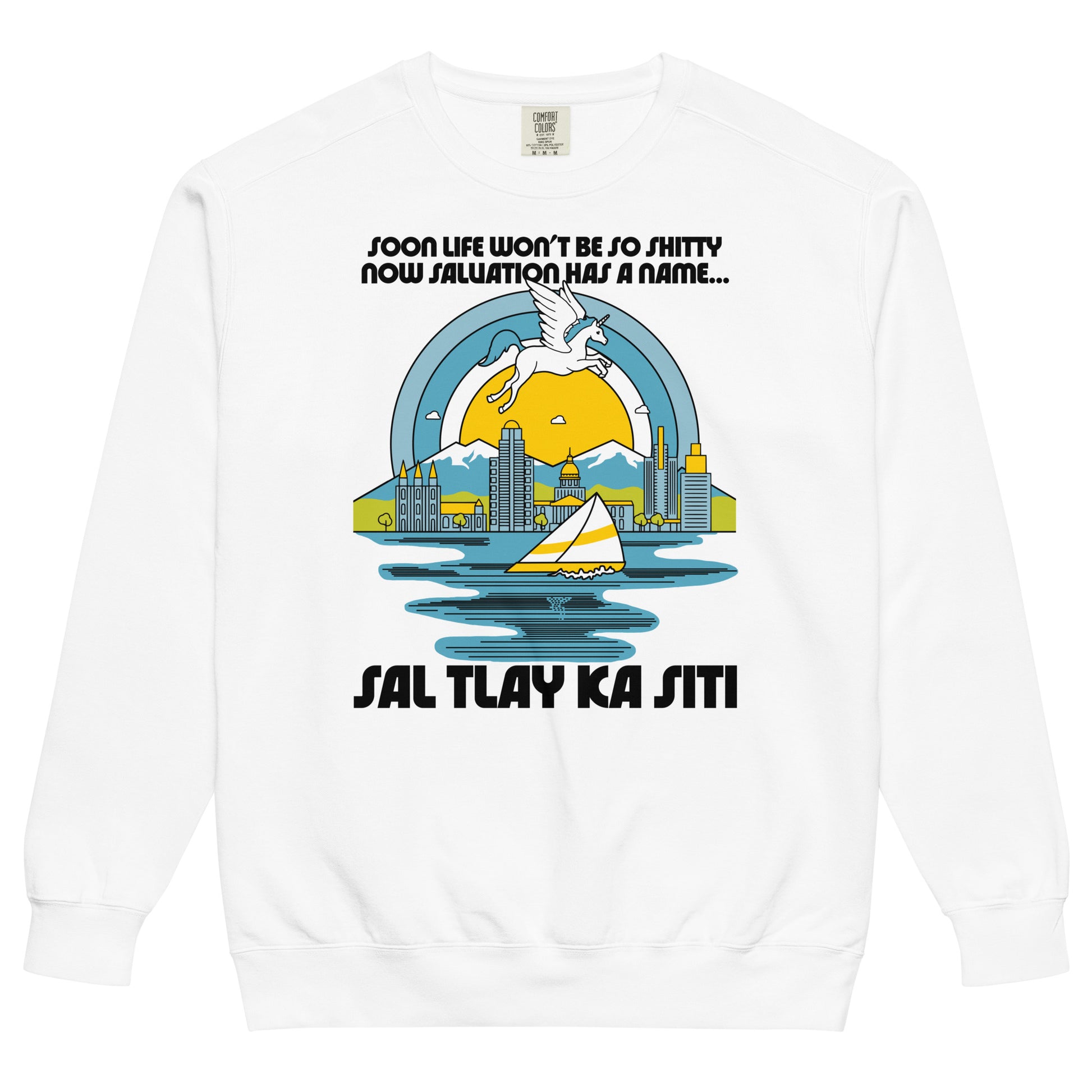 A crew neck white 80s style vintage sweatshirt. Has lyrics from the song Sal Tlay Ka Siti, from the musical The Book of Mormon, "Soon life won't be so shitty now salvation has a name...". Image of a magical blue and white unicorn floating above Salt Lake City, Utah, considered paradise in the song, with a picturesque yellow and white sailboat on the Great Salt Lake and a beautiful yellow sun surrounded by a blue sky. 