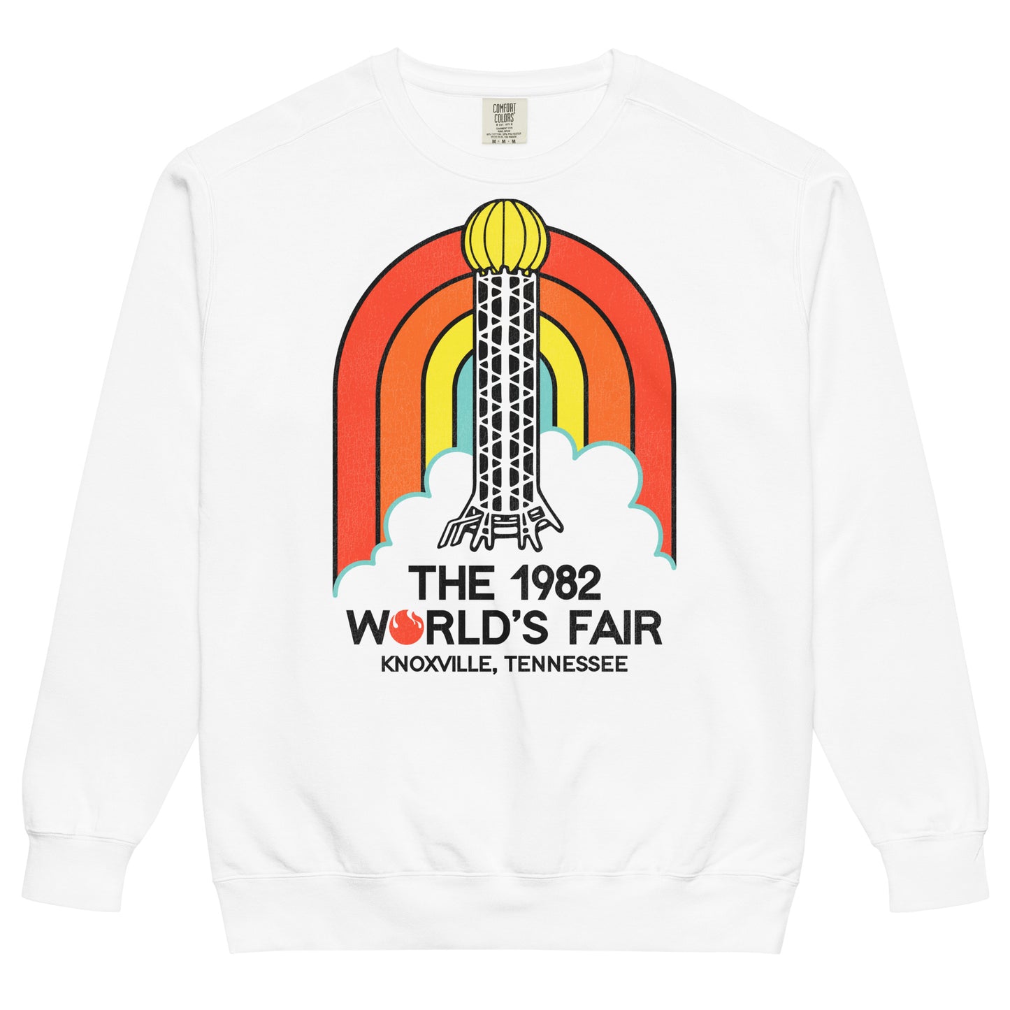 A white crew neck sweatshirt for tourists that says "The 1982 World's Fair" from "Knoxville, Tennessee". Image of a red, orange, yellow, and blue rainbow and clouds and the famous Sunsphere steel tower with a gold colored globe on top, an iconic image of the fair with its theme of "Energy Turns the World". 