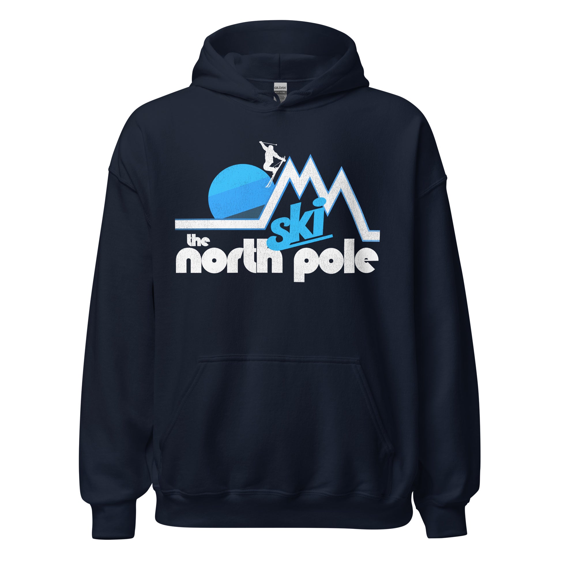 A navy colored vintage navy hooded sweatshirt for travel that says "Ski the North Pole". Includes the image of three mountain peaks in white and blue, a sun behind the mountains, and a skier doing a stylized jump off of the top. 
