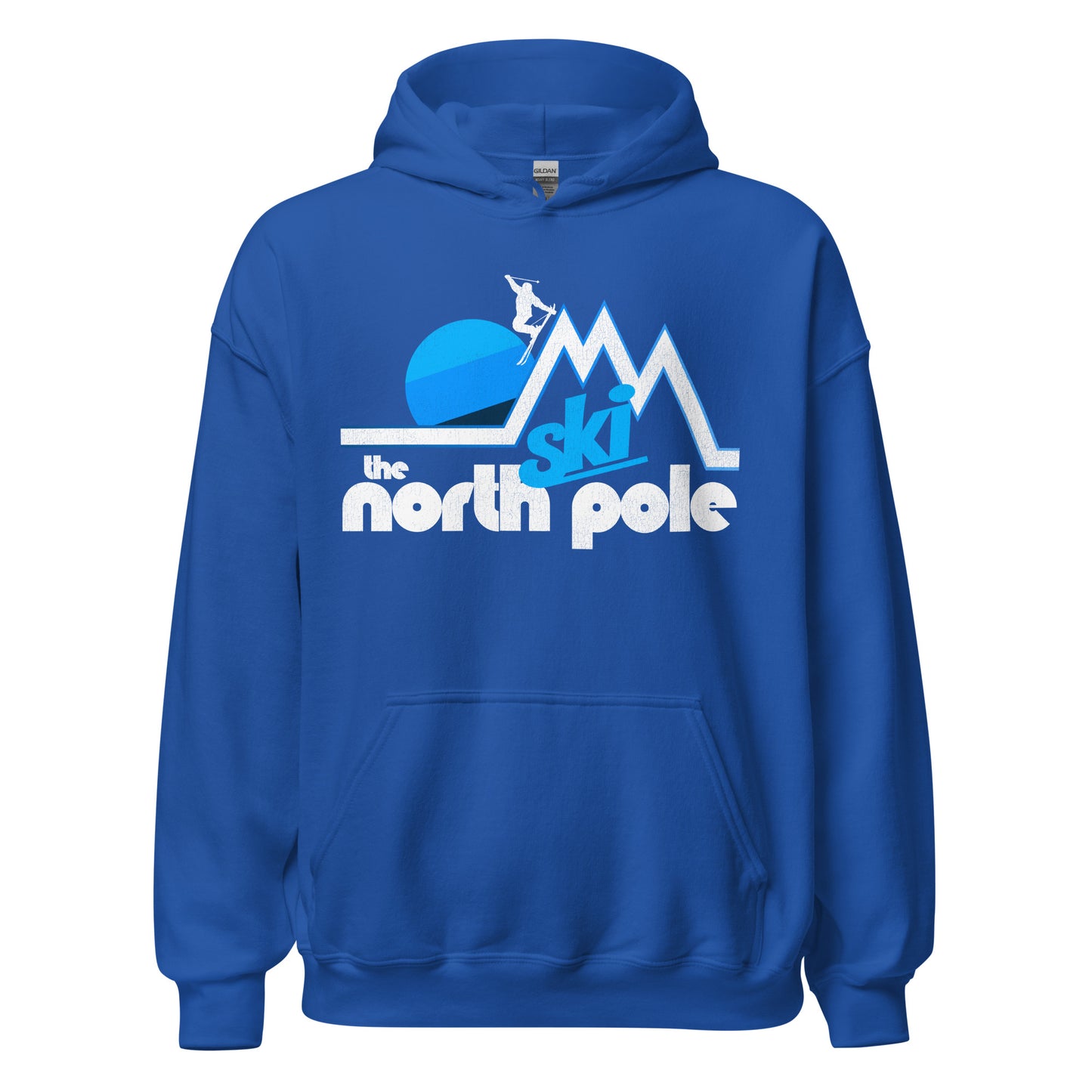 A royal blue retro 70s style "Ski the North Pole" hooded sweatshirt. Image of a mountain landscape and a striped blue sun setting as a skier jumps off the top peak in an aesthetic pose. 