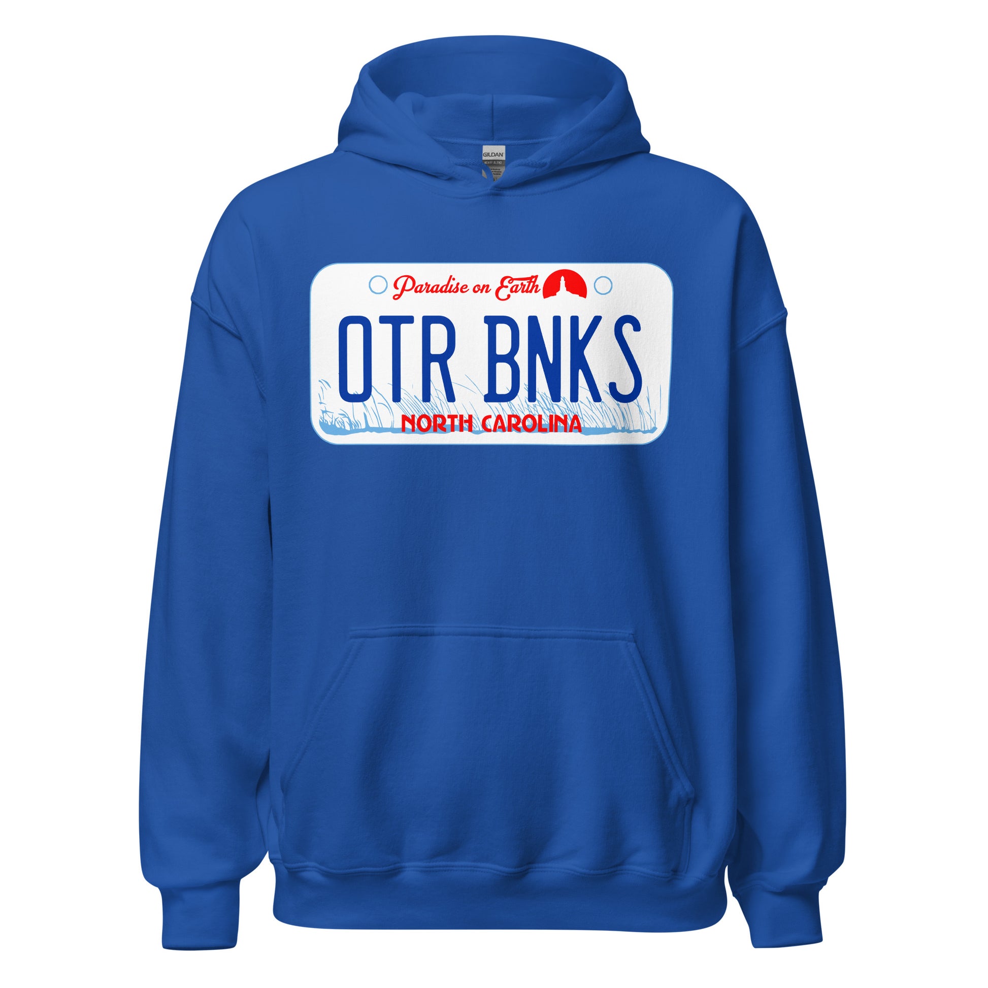 A royal blue Outer Banks retro 70s style hooded sweatshirt with the image of a car license plate with that says "OTR BNKS", "North Carolina", and "Paradise on Earth" in front of light blue American beachgrass swaying in the wind a tiny lighthouse circular red icon. References the Netflix 2020 5 season TV Series that takes place in OBX. 