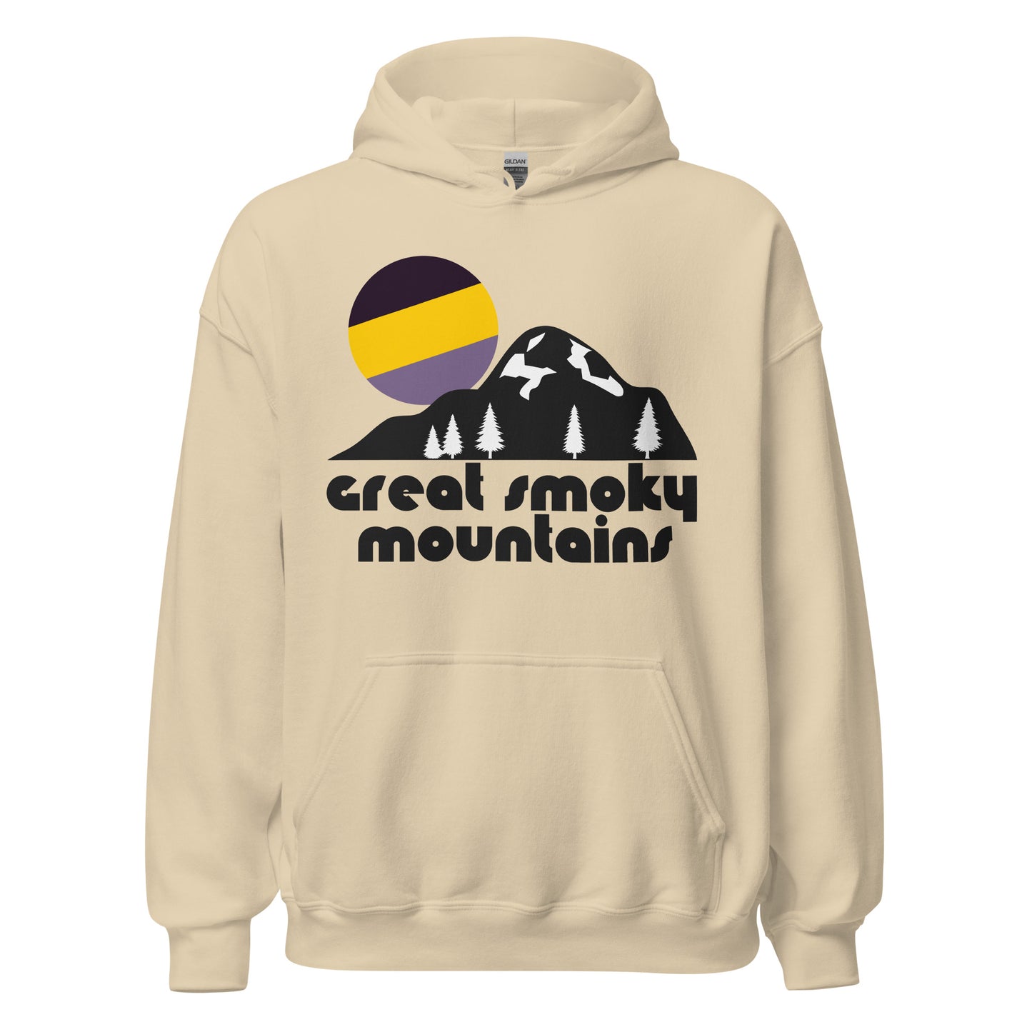 A vintage souvenir hooded sweatshirt in a sand color that reads 'great smoky mountains' underneath the image of a large mountain, its base dotted with pine trees, a tricolored bright purple and yellow sun rising above its peak. In reference to Great Smoky Mountains National Park, a popular destination for hiking, backpacking, and skiing, multiple mountain ranges like the Appalachians and Blue Ridge Mountains.  