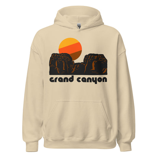 A retro, 80s style sand colored hoodie sweatshirt that says 'grand canyon' underneath the image of a red rock landscape, with a canyon in the center, and a warm toned sun setting. References the Grand Canyon National Park, en of the most popular destinations in the US, with famous sites like the South Rim, Mather Point, the Bright Angel Trail for hiking, Hopi Point, and Yavapai Point. 