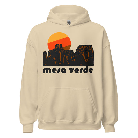 A retro, 70s style sand colored "mesa verde" souvenir hoodie sweatshirt with the picture of a beautiful southwestern red rock landscape, completed by a setting red/orange/brown sun. References the famous Mesa Verde National Park in Colorado, known for its well preserved and protected cliff dwellings and archeological sites of the ancient Ancestral Puebloans, a Native American people. 