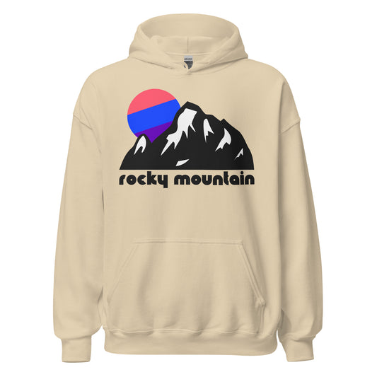 A retro, 70s style 'rocky mountain' sand colored hooded sweatshirt with a mountain landscape image, the peaks covered in snow as a sun in blues, pinks, and purples sets in the distance. References the world famous Rocky Mountain National Park, famous in history for the Gold Rush and famous in America today for its world renowned hiking trails, ski resorts, and high concentration of fourteeners. 