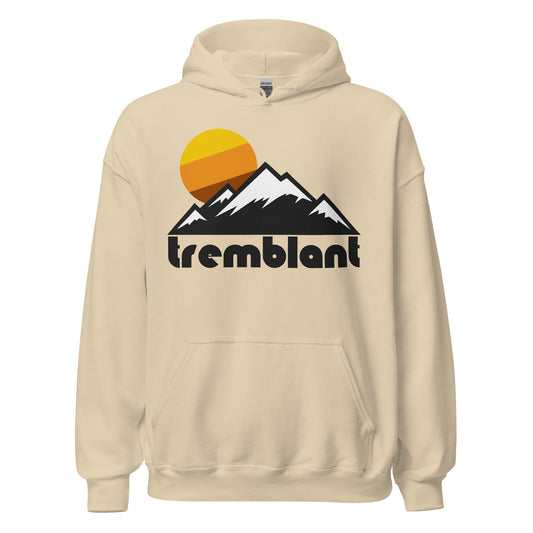 A sand colored retro, tourist hooded sweatshirt from Tremblant (Mont-Tremblant Ski Resort) with images of mountains and a sun setting in yellow, orange, and brown colors. Known as one of the top ski resorts in North America, with stunning views of Quebec's Laurentian Mountains. 