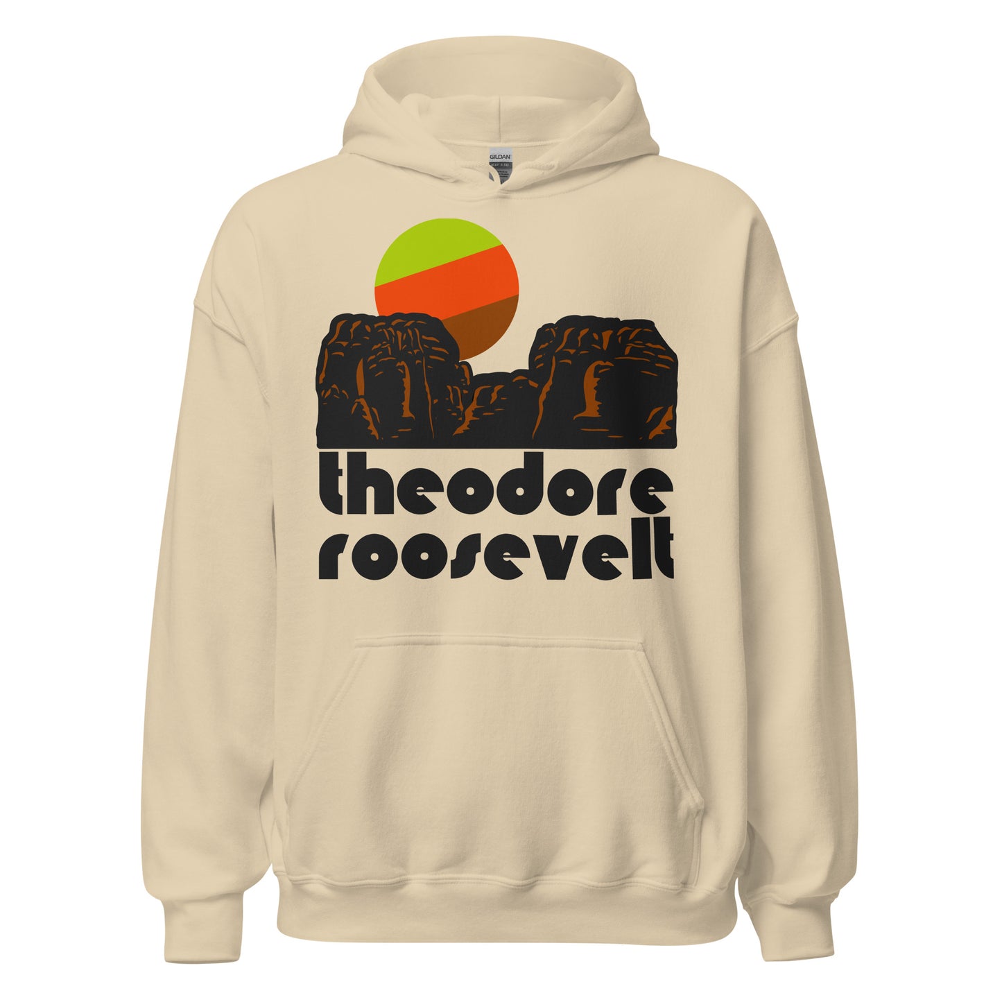 A sand colored "Theodore Roosevelt" National Park 80s style hooded sweatshirt the image of a red/brown rocky Badlands landscape under a red/green/brown sun. The North Dakotan park is famous for Little Missouri River, it's stunning views of the Badlands and the Great Plains, as well as wildlife like bison. 