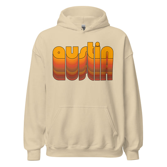 A sand colored Austin, Texas hooded sweatshirt perfect for travel and tourists. Says the word Austin in 3-d bubble letters in various shades of orange, red, and green melting into each other. 