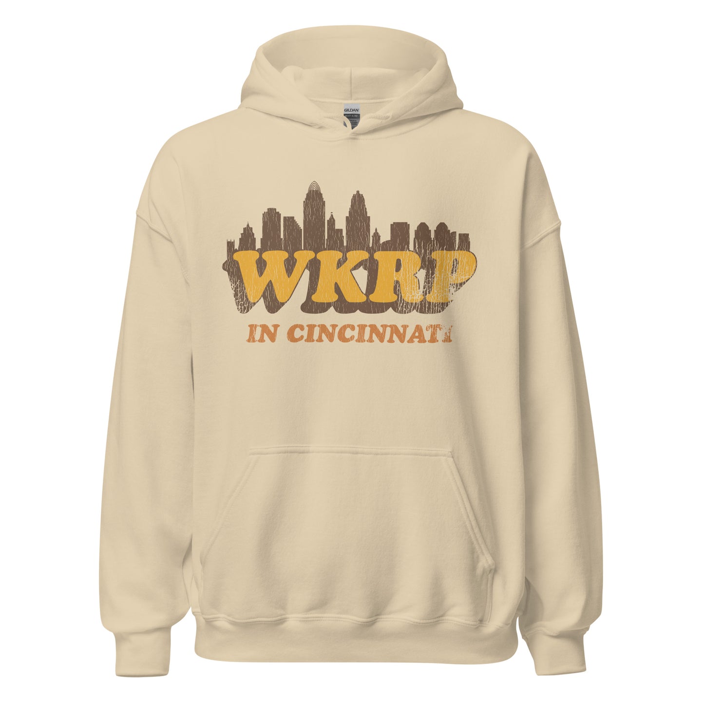 A sand colored retro 70s style WKRP in Cincinnati hoodie sweatshirt in reference to the sitcom TV series which ran in the 70s - 80s with an image of the Cincinnati, Ohio skyline. 