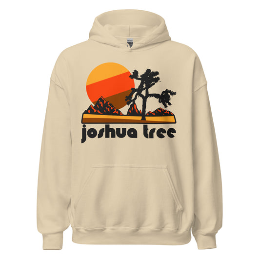 A retro travel sand colored hooded sweatshirt with Joshua Tree under an image of the National Park in California, with a cactus looking tree, red mountains, and a yellow, red, and brown sun. 